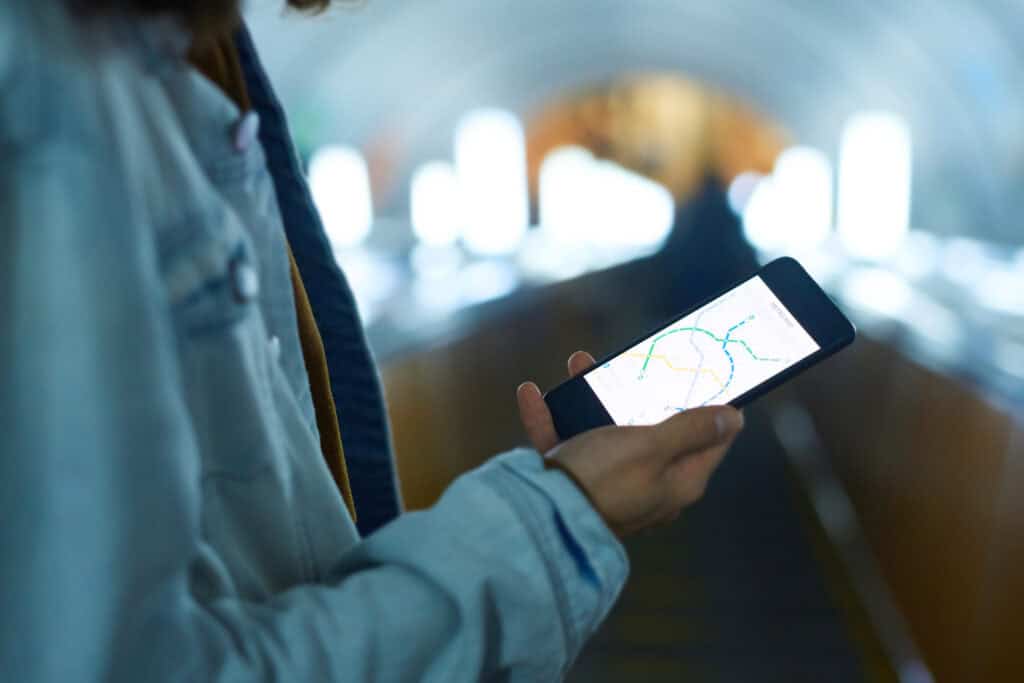 rider checking a subway map on a phone 2026 09 23 23 11 42 utc