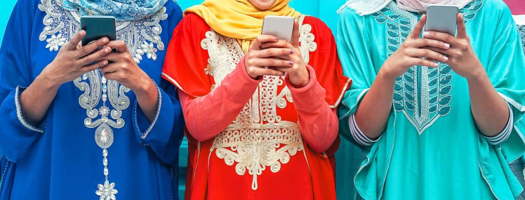 women in colorful clothing using mobile phones 2026 09 22 22 27 40 utc