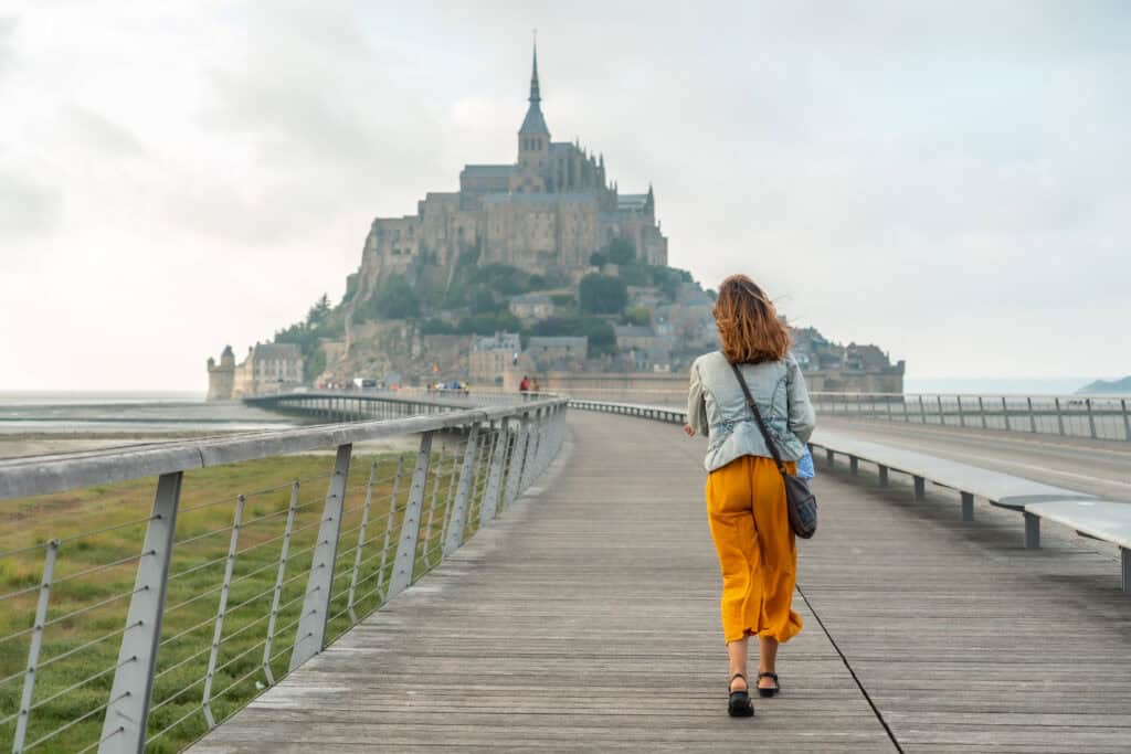 a young tourist visiting the famous mont saint mic 2026 09 21 11 17 04 utc