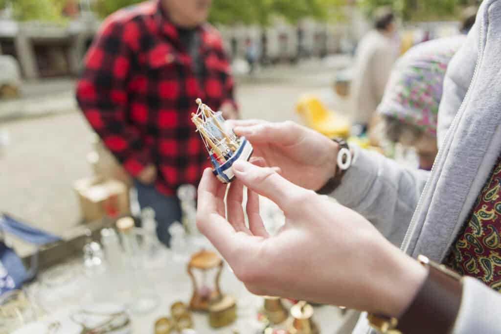 browsing wares at an outdoor flea market 2026 09 22 17 02 48 utc
