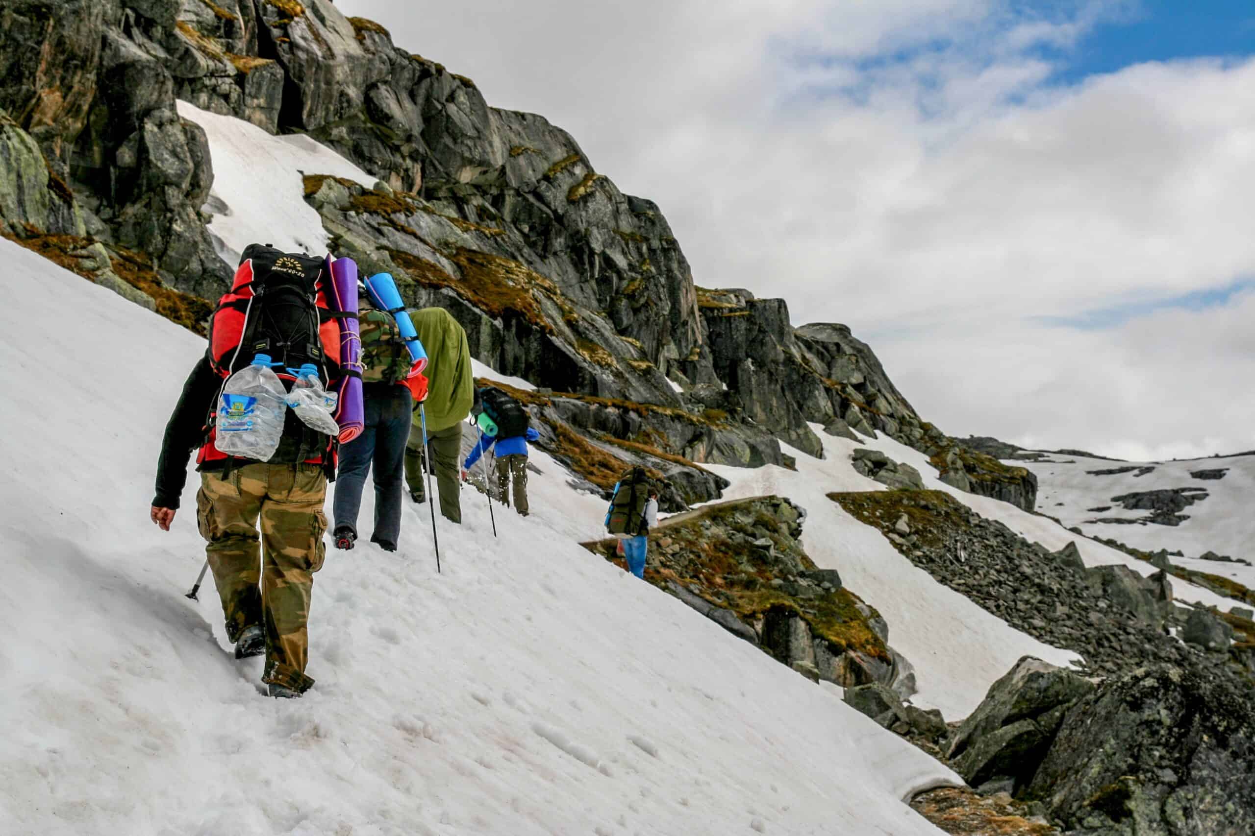 equipped tourists on a snowy steep slope in the mo 2026 09 23 03 29 30 utc