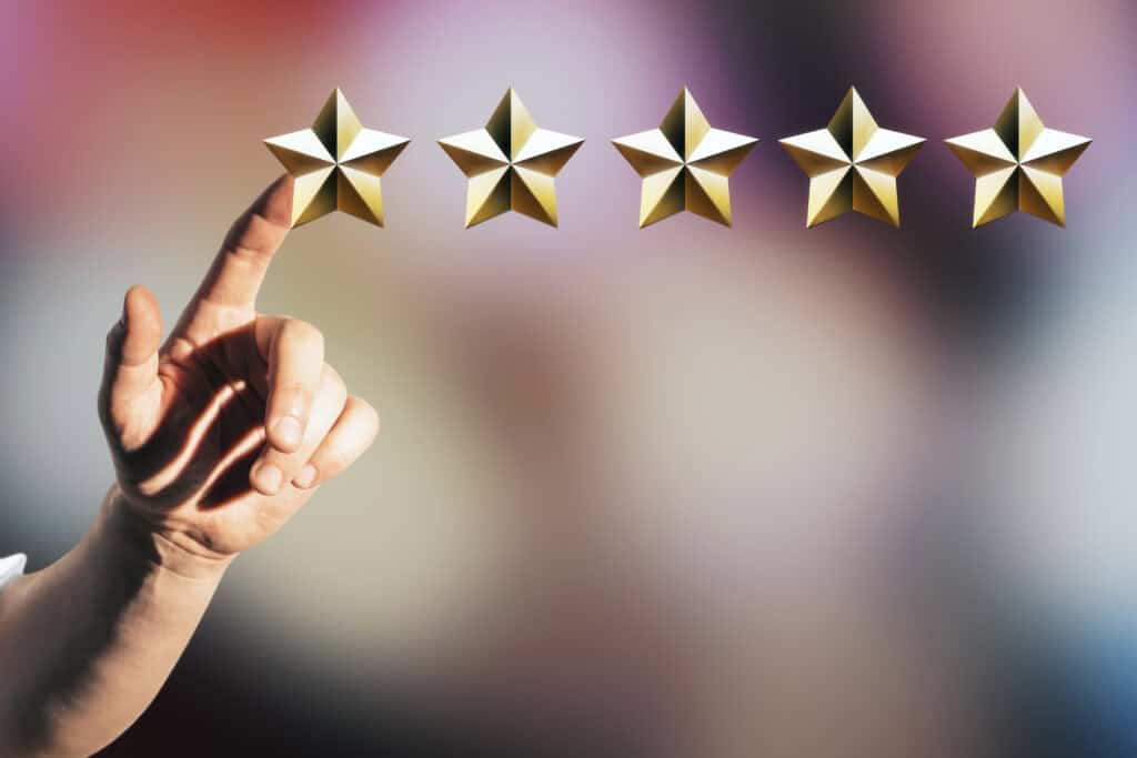 five stars with hand for rating or feedback 2026 09 24 21 07 21 utc