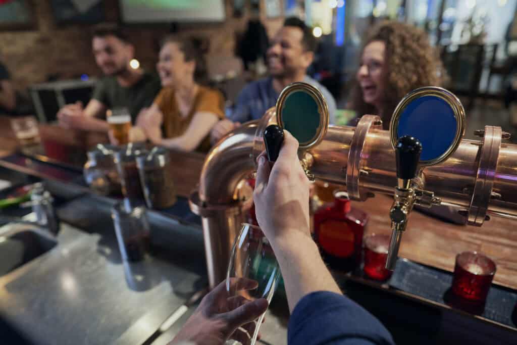 people enjoying drinks in a bar at night 2026 09 22 22 19 26 utc