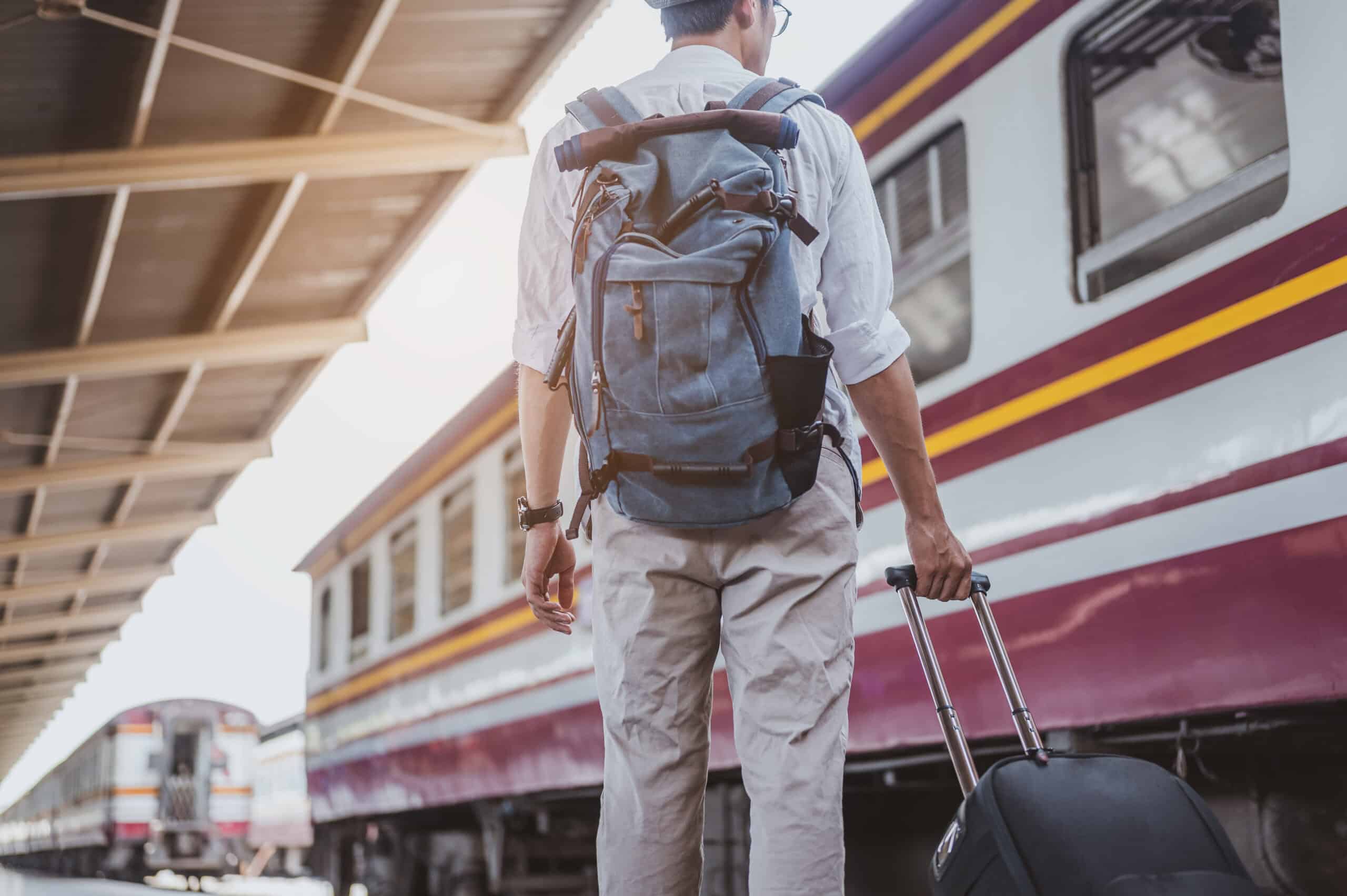 traveler with luggage and backpack at train statio 2026 09 23 05 45 08 utc