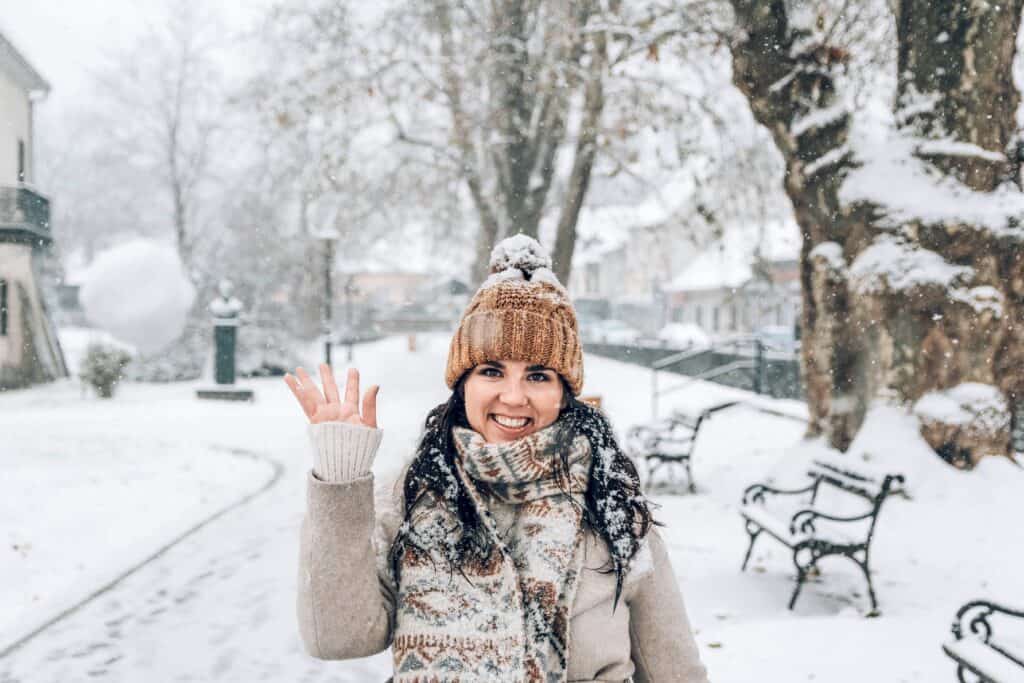 woman enjoying winter weather outdoors in a city 2026 09 21 20 16 12 utc